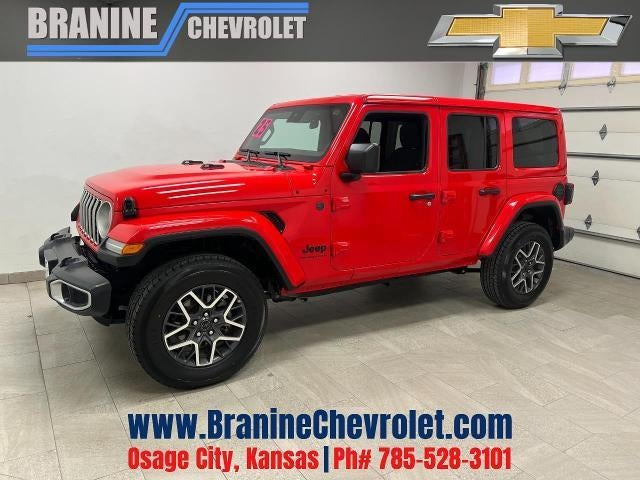 2025 Jeep Wrangler Sahara in Red — front three-quarter view