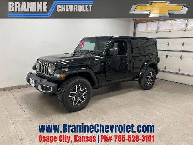 2025 Jeep Wrangler Sahara in Black — front three-quarter view